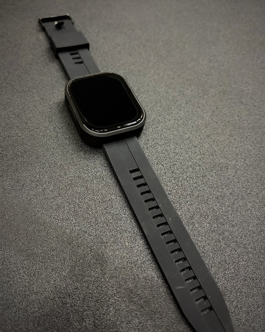 A PitchKallr Watch on its black silicone strap, photographed at an angle.
